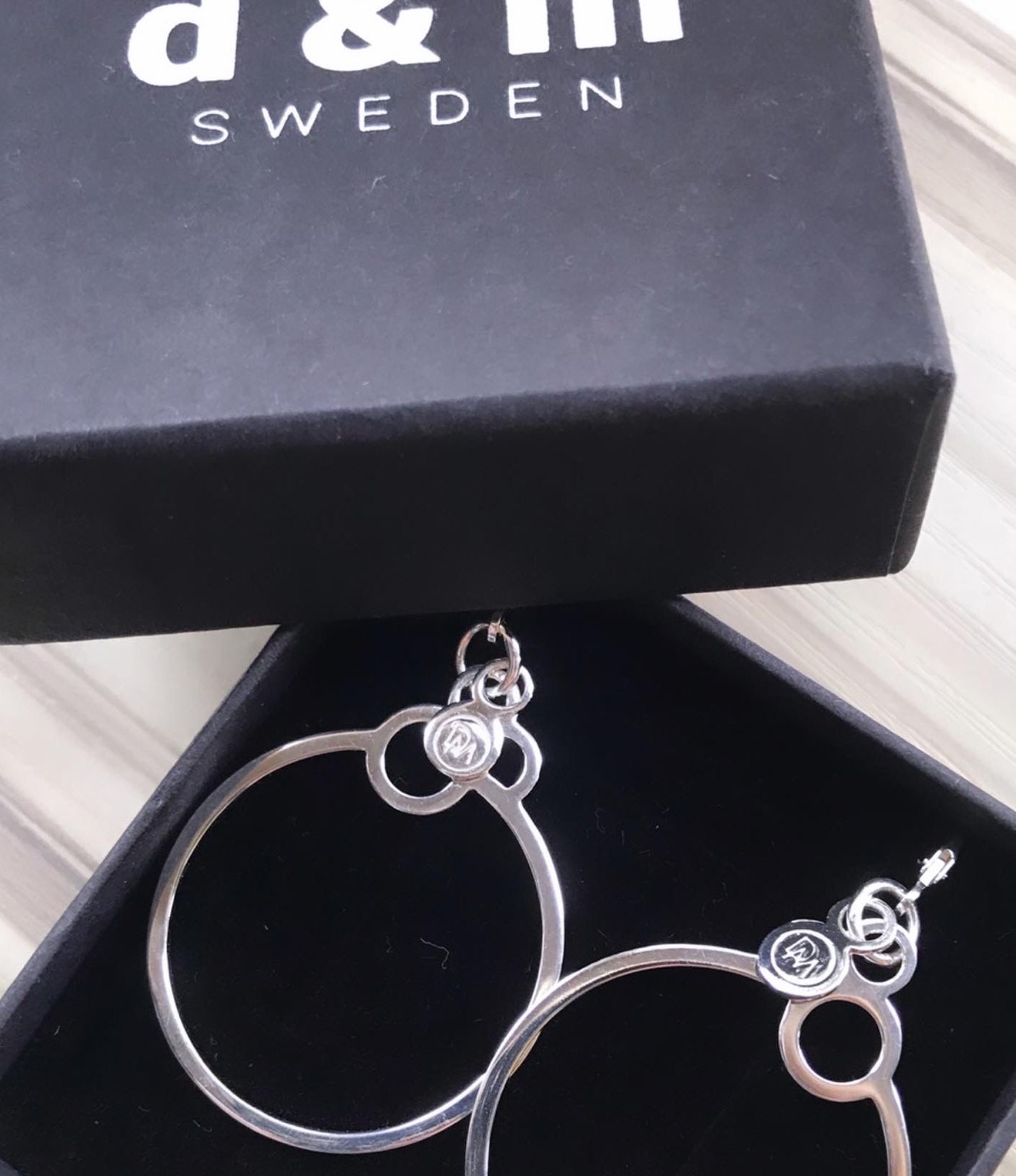 Extra light, gentle 925 silver hoop earrings with a logo from Circles collection.   Material: 925 silver.   Size: hoop diameter - 3cm.