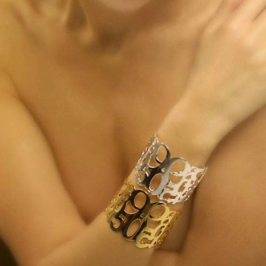 Conceptual chunky cuff bracelet from popular Numbers collection.  Material: 18 karat gold-plated silver.  Size: adjustable, fits any wrist. 