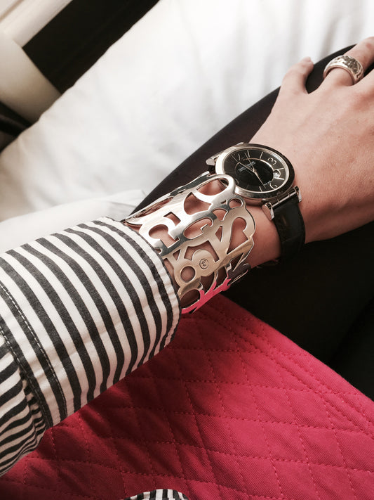 Conceptual chunky cuff bracelet from popular Numbers collection.  Material: 18 karat gold-plated silver.  Size: adjustable, fits any wrist. 