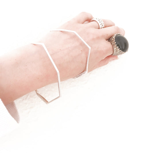 Minimalist bangle bracelet from iconic Facet collection.  Material: 925 silver.